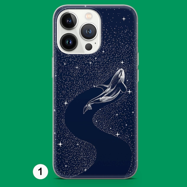 May include: A navy blue phone case with a white illustration of an orca whale leaping through a starry night sky. The design includes a dark blue path and numerous white stars, creating a celestial theme.