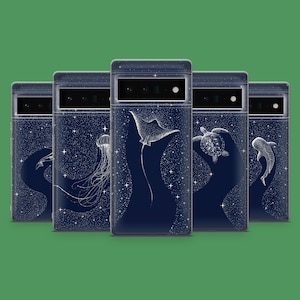 May include: A collection of five navy blue phone cases with a starry night design. Each case features a different white illustration of marine life, including a jellyfish, manta ray, sea turtle, and dolphin.