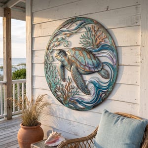 May include: A circular metal wall art piece featuring a sea turtle swimming among coral and waves. The design is finished in shades of teal, copper, and blue, with intricate cutouts creating a layered effect within the round frame.
