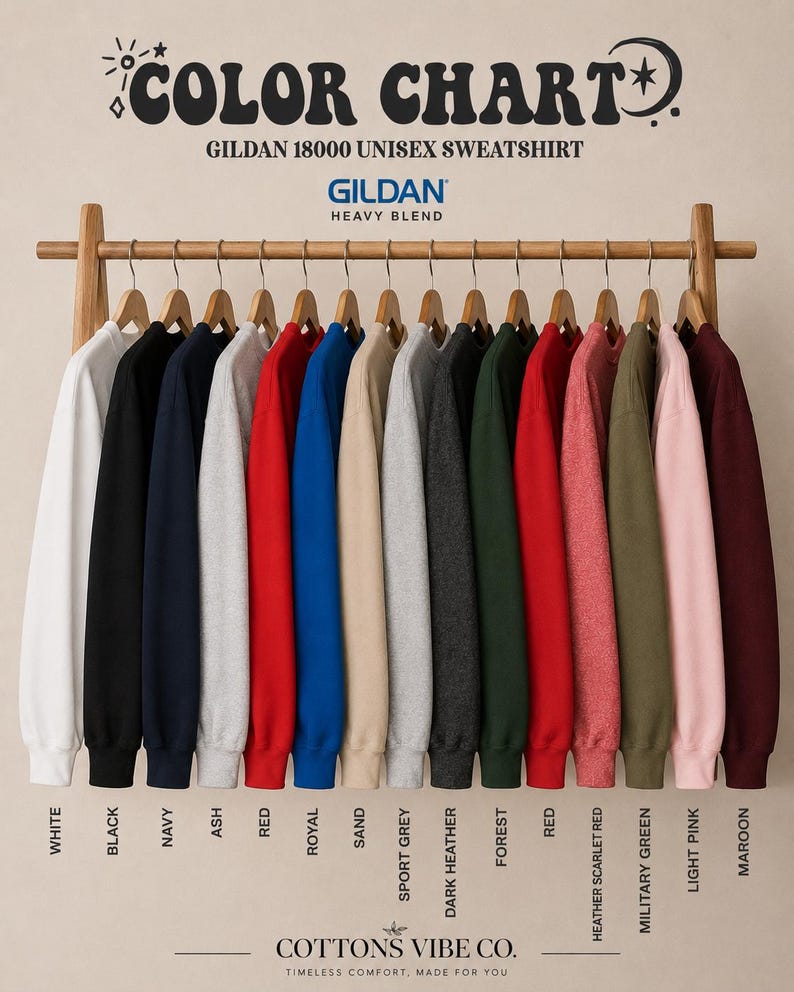 May include: A Gildan 18000 heavy blend sweatshirt color chart featuring fifteen long-sleeve crewneck sweatshirts in various colors hanging on a wooden rack. Text includes COLOR CHART, GILDAN 18000 UNISEX SWEATSHIRT, and color names like White, Black, Navy, Ash, Red, Royal, Sand, Sport Grey, Dark Heather, Forest, Heather Scarlet Red, Military Green, Light Pink, and Maroon.