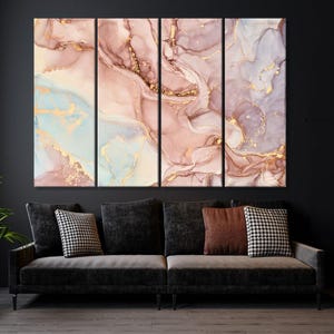 May include: Five-panel abstract art piece with a marble effect. The artwork features swirling patterns in shades of pink, blue, and gold. The canvas is mounted above a dark gray sofa with decorative pillows.