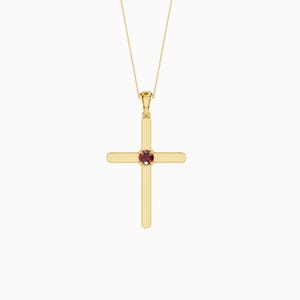 Könnte beinhalten: Ein goldfarbener Kreuzanhänger mit einem kleinen, runden, roten Edelstein in der Mitte. Das Kreuz hängt an einer zarten Goldkette. Der Anhänger hat ein schlichtes, elegantes Design.