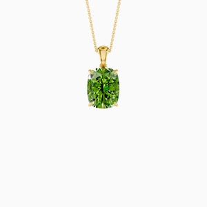 May include: A gold pendant necklace featuring a large, cushion-cut, vibrant green gemstone. The gemstone is set in a gold bezel and hangs from a delicate gold chain. The pendant is a striking piece of jewelry.