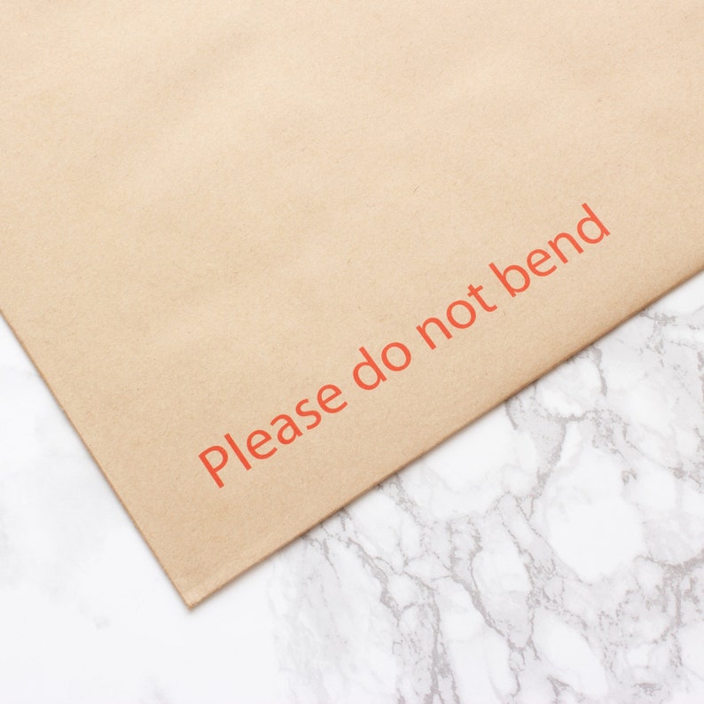 Please do not bend envelope on marble background.