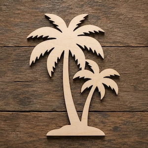 May include: A flat, light-coloured wooden cutout shaped like two palm trees of different sizes. The larger tree stands on the left with a taller trunk, while a smaller palm tree is positioned to its right. Both trees feature jagged fronds.