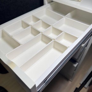 Modular Drawer Organization Dividers for IKEA ALEX Desk | Custom Storage Organizer | Desk Drawer Inserts for Office, Craft & Home, make up organizer, bathroom drawer organizer, desk organizer, kitchen storage, kitchen organization, bathroom organizer, drawer inserts, May include: A white drawer organizer with multiple compartments. The drawer contains hair accessories, pens, and other small objects. The text on the image reads Modular Design & Perfect Fit for IKEA Alex Drawer