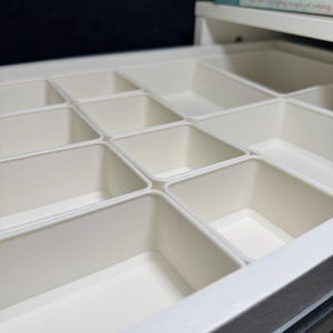 Modular Drawer Organization Dividers for IKEA ALEX Desk | Custom Storage Organizer | Desk Drawer Inserts for Office, Craft & Home, make up organizer, bathroom drawer organizer, desk organizer, kitchen storage, kitchen organization, bathroom organizer, drawer inserts, May include: A white drawer organizer with multiple compartments. The drawer contains hair accessories, pens, and other small objects. The text on the image reads Modular Design & Perfect Fit for IKEA Alex Drawer