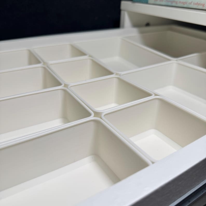 Modular Drawer Organization Dividers for IKEA ALEX Desk | Custom Storage Organizer | Desk Drawer Inserts for Office, Craft & Home, make up organizer, bathroom drawer organizer, desk organizer, kitchen storage, kitchen organization, bathroom organizer, drawer inserts, May include: A white drawer organizer with multiple compartments. The drawer contains hair accessories, pens, and other small objects. The text on the image reads Modular Design & Perfect Fit for IKEA Alex Drawer