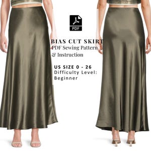 Puede incluir: Falda larga de corte al bies en color verde oliva con un brillo sutil. La falda se muestra desde la vista frontal y posterior. El texto en la imagen dice: "BIAS CUT SKIRT PDF Sewing Pattern & Instruction US SIZE 0 - 26 Difficulty Level: Beginner."