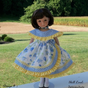 May include: Sewing pattern for a 13-inch doll dress. The dress is blue and yellow with a floral print and ruffles. The pattern is called "Morning Glory" and is for an intermediate skill level.
