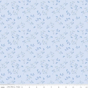 May include: Light blue fabric with a delicate floral pattern. The design features small, stylized flowers and leaves in shades of blue and white, creating a soft, repeating pattern. The fabric is measured in inches.