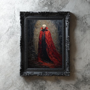 May include: A framed oil painting of a figure in a red cloak and black attire. The artwork is set against a dark, textured background and framed in an ornate black frame. The painting has a gothic or horror theme.
