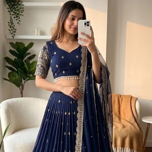 May include: A rustic wooden sign with the text "Welcome to our home" in white lettering. The sign has a distressed finish and a simple, inviting design, suitable for a front porch or entryway.