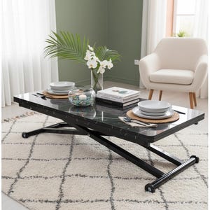 May include: A black marble-look lift-top coffee table with a black metal base. The table is set with two place settings, a glass bowl with decorative stones, and a vase of flowers. The table sits on a white rug.