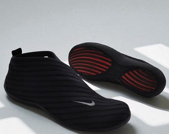 Zapatillas Nike Kyoto Slip On negras vintage estilo Y2K, modelo plano, talla UK 4.5