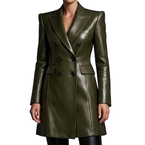 May include: Olive green leather double-breasted blazer with a notched lapel and two front pockets. The blazer has a tailored fit, long sleeves, and black buttons. The jacket is a classic, stylish outerwear piece.