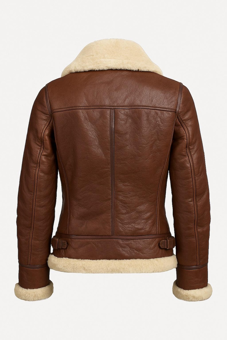 Back view of women’s brown leather shearling bomber jacket with fur lining – luxury winter outerwear