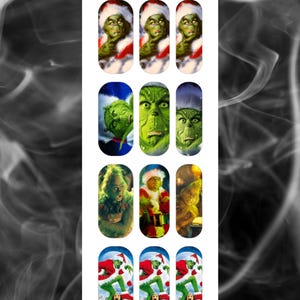 May include: A sheet of nail art featuring various images of the Grinch in different poses. The designs include the Grinch in a Santa hat and suit, and other Grinch-themed images. The brand name "A Touch of Evil" is at the top and bottom.