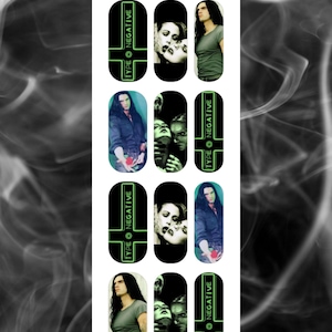 May include: Nail art set featuring images of a band member, a woman, and the text "TYPE O NEGATIVE" in green on a black background. The set includes various images and the text "A Touch of Evil" in a decorative font.