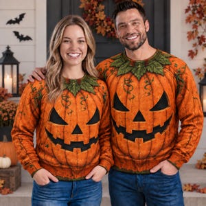 May include: Two long-sleeve crewneck sweaters featuring a realistic, vibrant orange pumpkin print with a carved jack-o'-lantern face, black triangular eyes, a nose, and a jagged mouth, finished with green leaf detailing around the neckline.