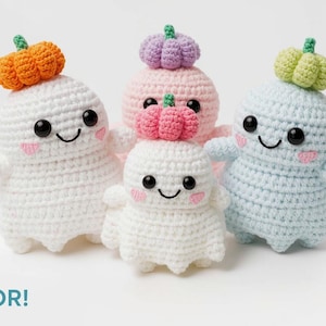 May include: A group of four crocheted ghost figures, each with a pumpkin hat. The ghosts are white, pink, and blue, with black eyes, rosy cheeks, and smiling mouths. The pumpkins are orange, pink, and green. Text reads "MAKE IN ANY COLOR!"