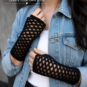 May include: Black fishnet crochet gloves featuring an open diamond-patterned weave. The text FISHNET CROCHET GLOVES CREATE YOUR OWN STYLE is visible at the top. These fingerless gloves extend from the knuckles to the mid-forearm.