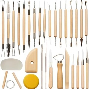 May include: A set of pottery and sculpting tools with wooden handles and various metal tips. The tools include loop tools, ribbon tools, modeling tools, and a sponge. The set is designed for shaping and detailing clay.