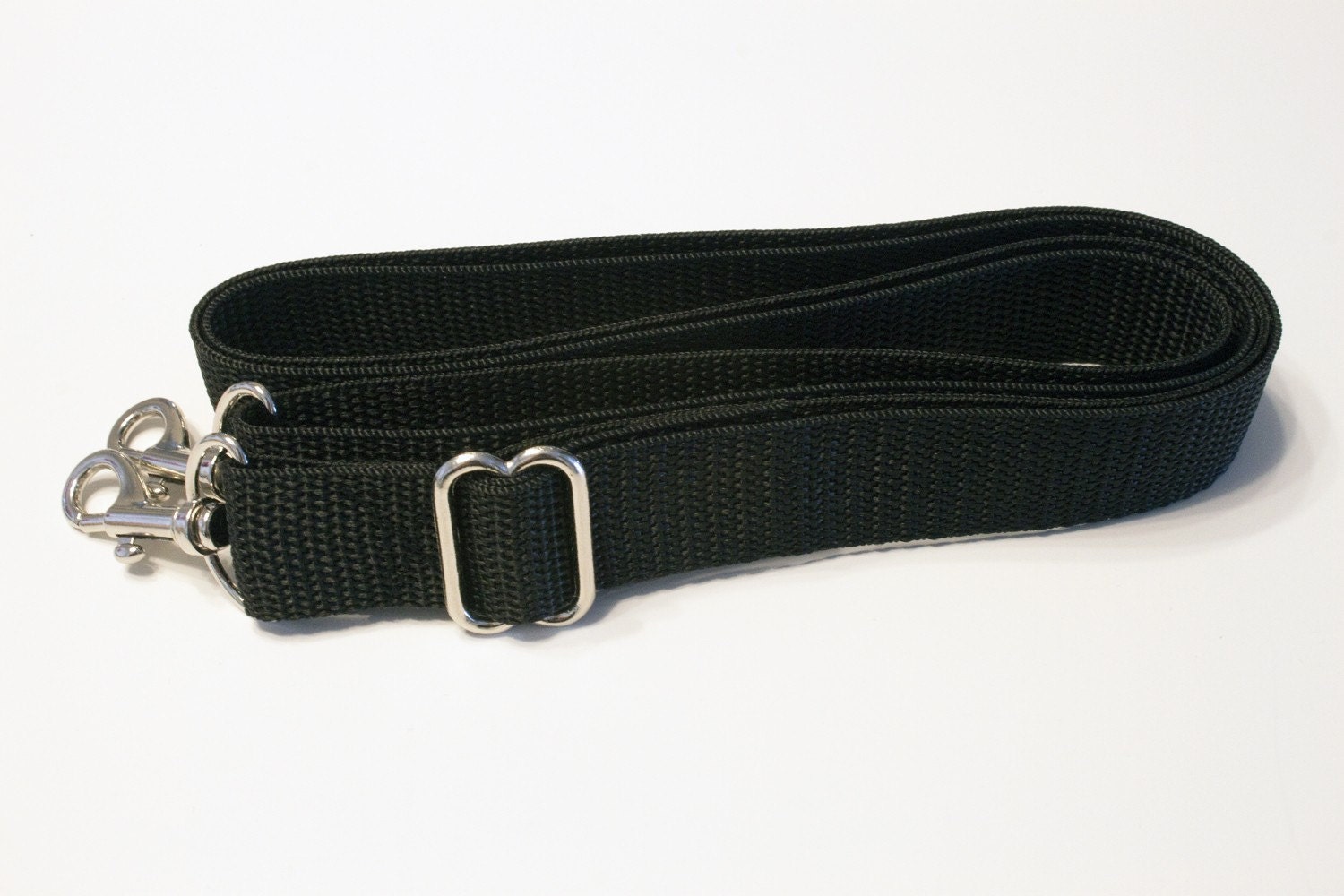 Adjustable, Detachable Strap - approximately 29-57 inches
