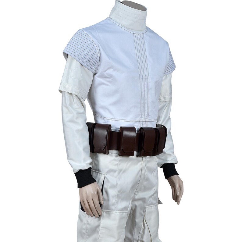 May include: A white costume with a high collar and short sleeves. The outfit includes a brown belt with pouches and white pants. The sleeves have black cuffs. The costume has vertical and horizontal stitching details.