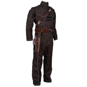 May include: A brown jumpsuit with white stitching, a high collar, and long sleeves. The costume includes a brown leather holster, belt, and shoulder strap. The outfit is designed with a futuristic or sci-fi aesthetic.
