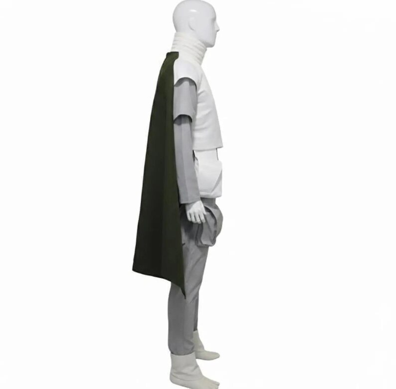 May include: A costume featuring a white turtleneck, a white top with gray sleeves, gray pants, and white boots. A dark green cape drapes over the shoulder. The outfit is displayed on a mannequin.