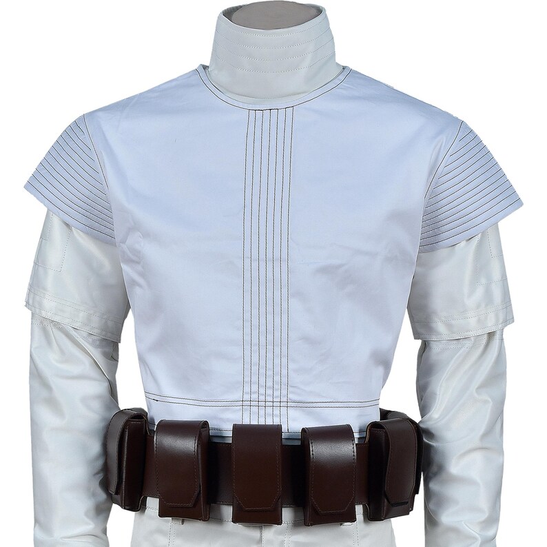 May include: A white costume featuring a high collar, short sleeves, and vertical stitching down the front. A brown belt with multiple pouches is worn around the waist. The sleeves are long and white.
