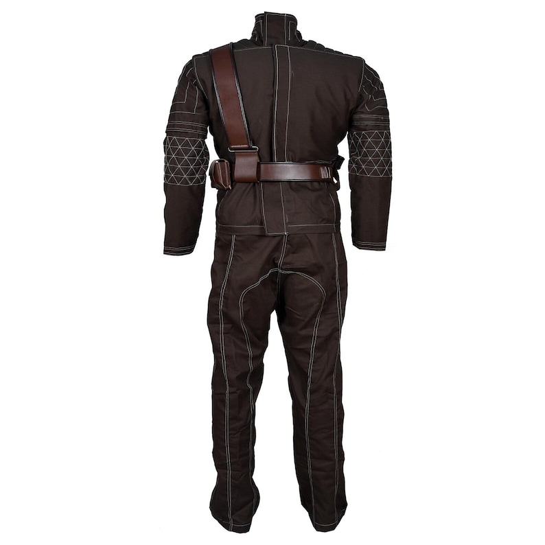 May include: A brown jumpsuit with white stitching and a high collar. The outfit includes a brown belt, a shoulder strap, and a small pouch. The sleeves and shoulders have a geometric design.