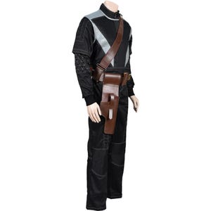May include: Black jumpsuit with gray and silver accents, featuring a brown leather shoulder strap and utility belt. The outfit includes a holster and is designed with white stitching details. The overall design suggests a futuristic or tactical theme.
