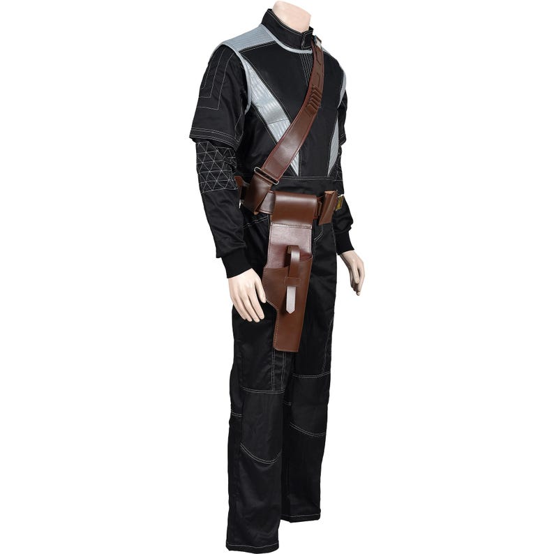 May include: Black jumpsuit with gray and silver accents, featuring a brown leather shoulder strap and utility belt. The outfit includes a holster and is designed with white stitching details. The overall design suggests a futuristic or tactical theme.