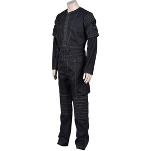 May include: Black jumpsuit with white stitching details. The outfit features a long-sleeved top with shoulder accents, a belted waist, and cargo pockets on the pants. The knees have reinforced panels. The garment is displayed on a mannequin.