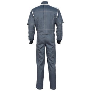 May include: A gray racing suit with white stitching and accents. The suit has long sleeves with black cuffs and a high collar. The back of the suit is visible, showing the zipper and seam details. This one-piece garment is designed for motorsports.