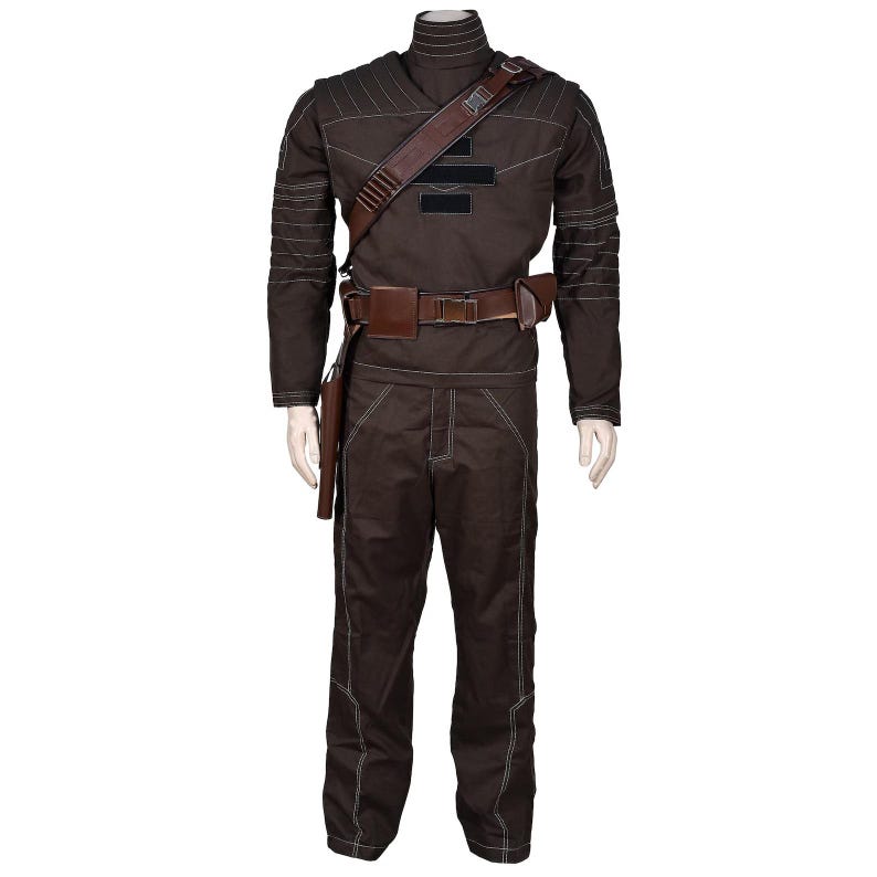 May include: A brown costume with white stitching, featuring a high collar, long sleeves, and matching pants. It includes a brown leather belt, shoulder strap, and holster. The outfit is displayed on a mannequin.