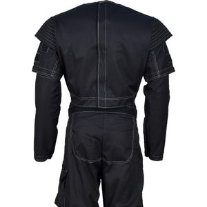 May include: Black jumpsuit with white stitching details. The garment features long sleeves, a structured shoulder design, and cargo pockets on the shorts. The back view showcases the tailored fit and contrasting white stitching.