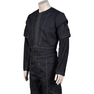 May include: Black jumpsuit with white stitching details. The garment features long sleeves, a round neckline, and a structured design with visible seams and panels. The jumpsuit has a utilitarian aesthetic, with a tailored fit and a mock neck.