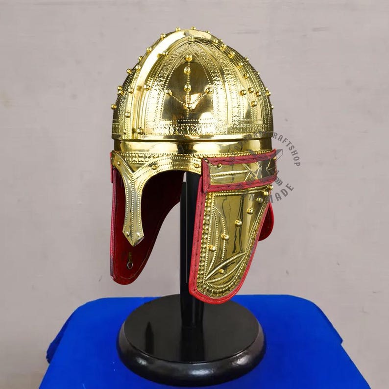 Handmade Roman brass helmet shown with size reference for historical armor and cosplay use