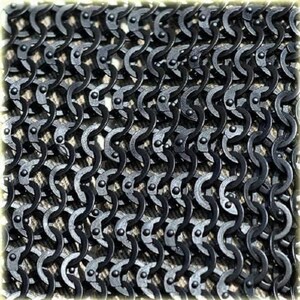 May include: Close-up of a section of chainmail armor. The interlocking metal rings are dark gray and arranged in a dense pattern. The links are riveted together, creating a flexible yet strong material. The overall texture is rough and metallic.