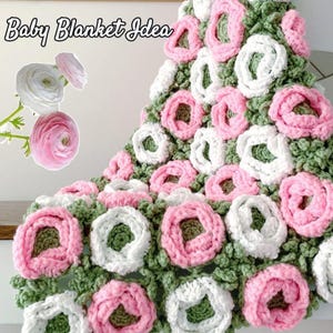 May include: Crocheted baby blanket with a floral design. The blanket features pink and white flower motifs set against a green background. The text "Baby Blanket Idea" is in the upper left corner.