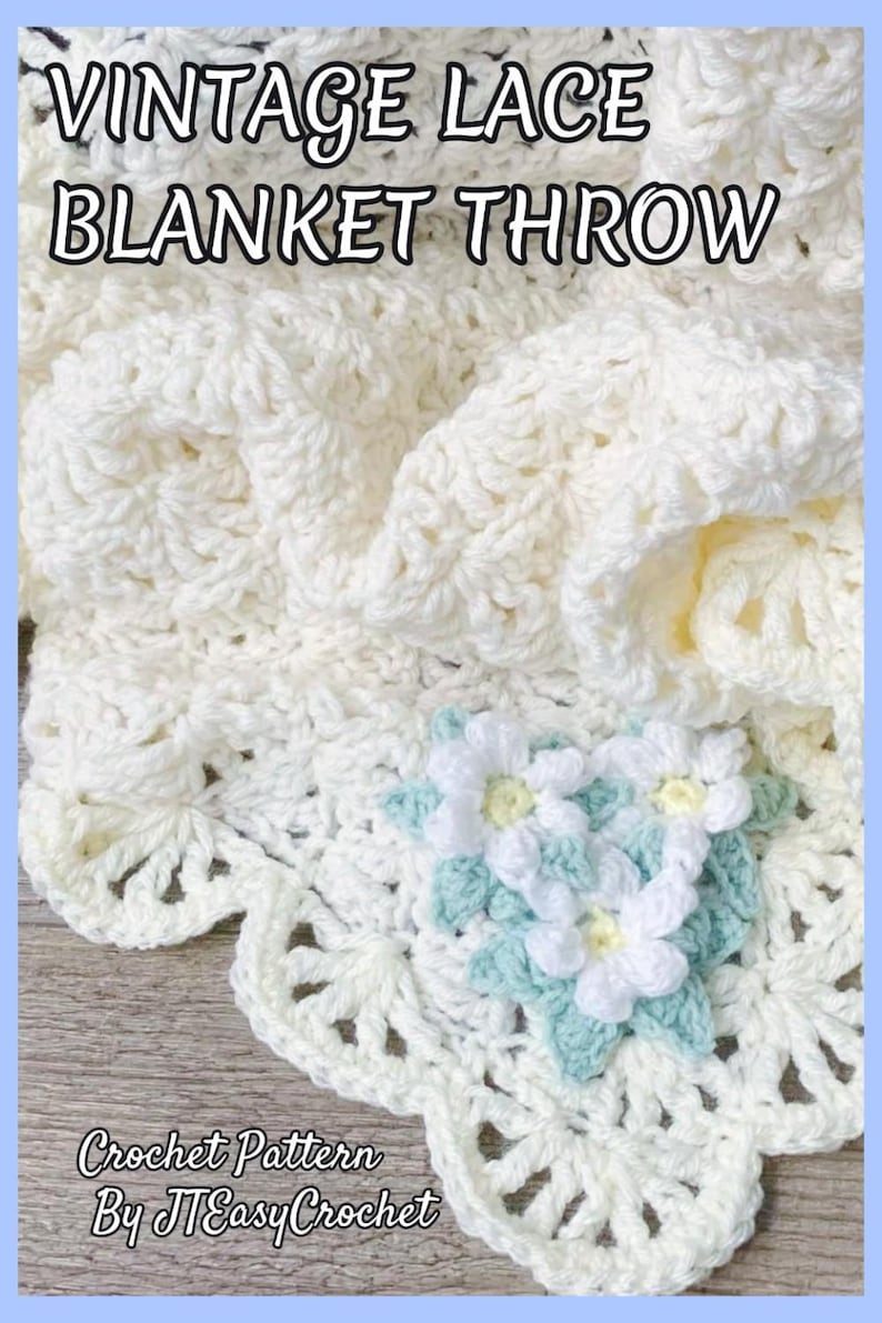 Beautiful lacy crochet blanket is laying tossed on a wooden surface. The blanket is crocheted with cream soft yarn and is airy and textured with the scalloped border giving it a vintage cottagecore vibe. There is a crochet flower applique in the corner of the blanket - three puffy white  daisies framed with pale green leaves. The lettering says: "Vintahe Lace Blanket Throw", "Crochet Pattern By JTEasyCrochet" meaningthat JTEasyCrochet has the best and easy crochet patterns.