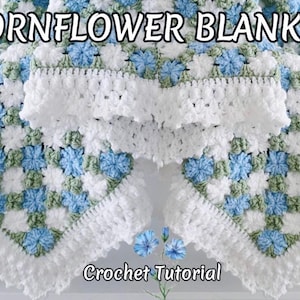 May include: A crocheted blanket with a floral design. The blanket has a repeating pattern of blue and white flowers with green details, and a white, ruffled edge. The text "Cornflower Blanket" and "Crochet Tutorial" are displayed.