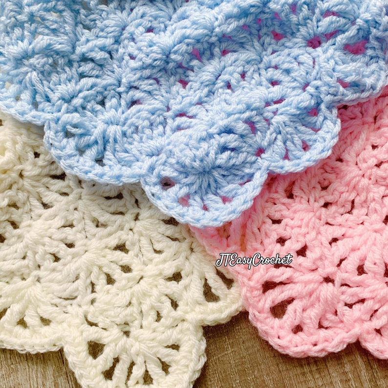 May include: Close-up of three crocheted items in pastel colors: light blue, cream, and pink. Each piece has a scalloped edge and a textured, openwork design. The text "JTEasy Crochet" is visible in the lower right corner.