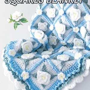 Beautiful crochet granny square blanket is hanging from a display on a light grey background. Each white granny square has a white textured gardenia flower in the center, framed with pale green leaves and light frosty blue border, so the whole blanket remind of a frozen gardenia blanket. There are also bunches of gardenia flowers in the image to highlight the likeness. The lettering logo says: " JTEasyCrochet"