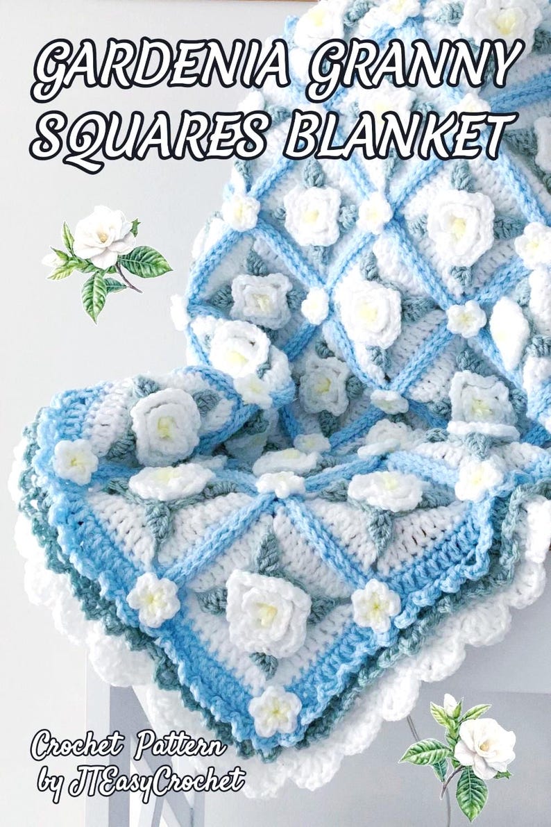 Beautiful crochet granny square blanket is hanging from a display on a light grey background. Each white granny square has a white textured gardenia flower in the center, framed with pale green leaves and light frosty blue border, so the whole blanket remind of a frozen gardenia blanket. There are also bunches of gardenia flowers in the image to highlight the likeness. The lettering logo says: " JTEasyCrochet"