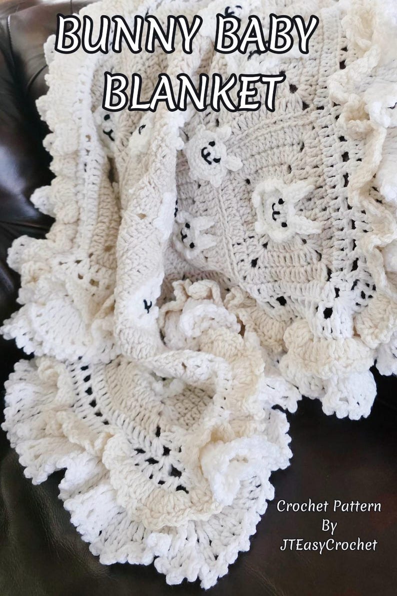 Beautiful Bunny  granny square blanket with fringed edging is laying on a dark leather couch. The blanket is cream with white bunnies on each square. The lettering says: “Bunny Baby Blanket”, “Crochet Pattern By JTEasyCrochet” meaning that JTEasyCrochet has the best crochet patterns and fun crochet ideas.