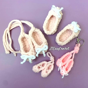 May include: A collection of handmade crochet ballet slippers in various sizes and styles. The slippers are primarily pink with light blue bows. Some are attached to keychains or cords. The text "JTEasyCrochet" is visible.